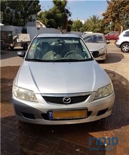 2002' Mazda 323 photo #1