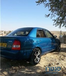 2000' Mazda 323 photo #1