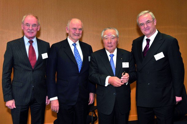 Osamu Suzuki (middle right), chairman of Suzuki Motor Corporation