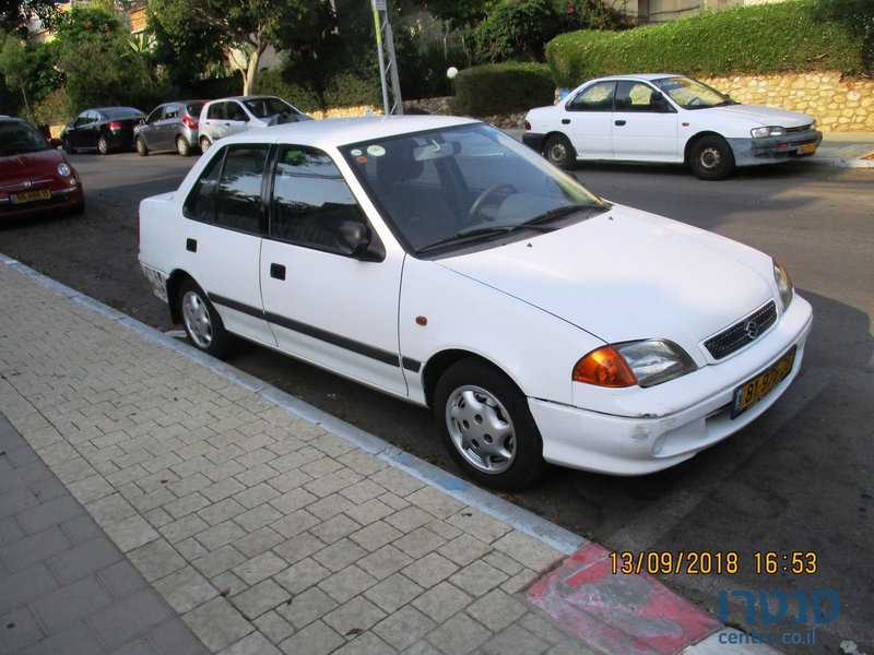 2002' Suzuki Swift седан photo #1