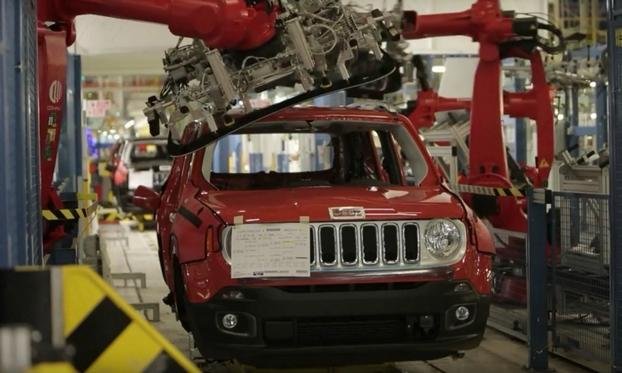 A robot fits a windshield on a Jeep Renegade at the Melfi plant in Italy.