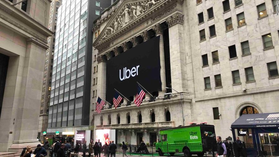 Uber prices its stock IPO at the low end, as trading begins on Friday
