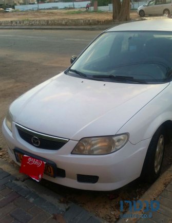 2003' Mazda 323 photo #1